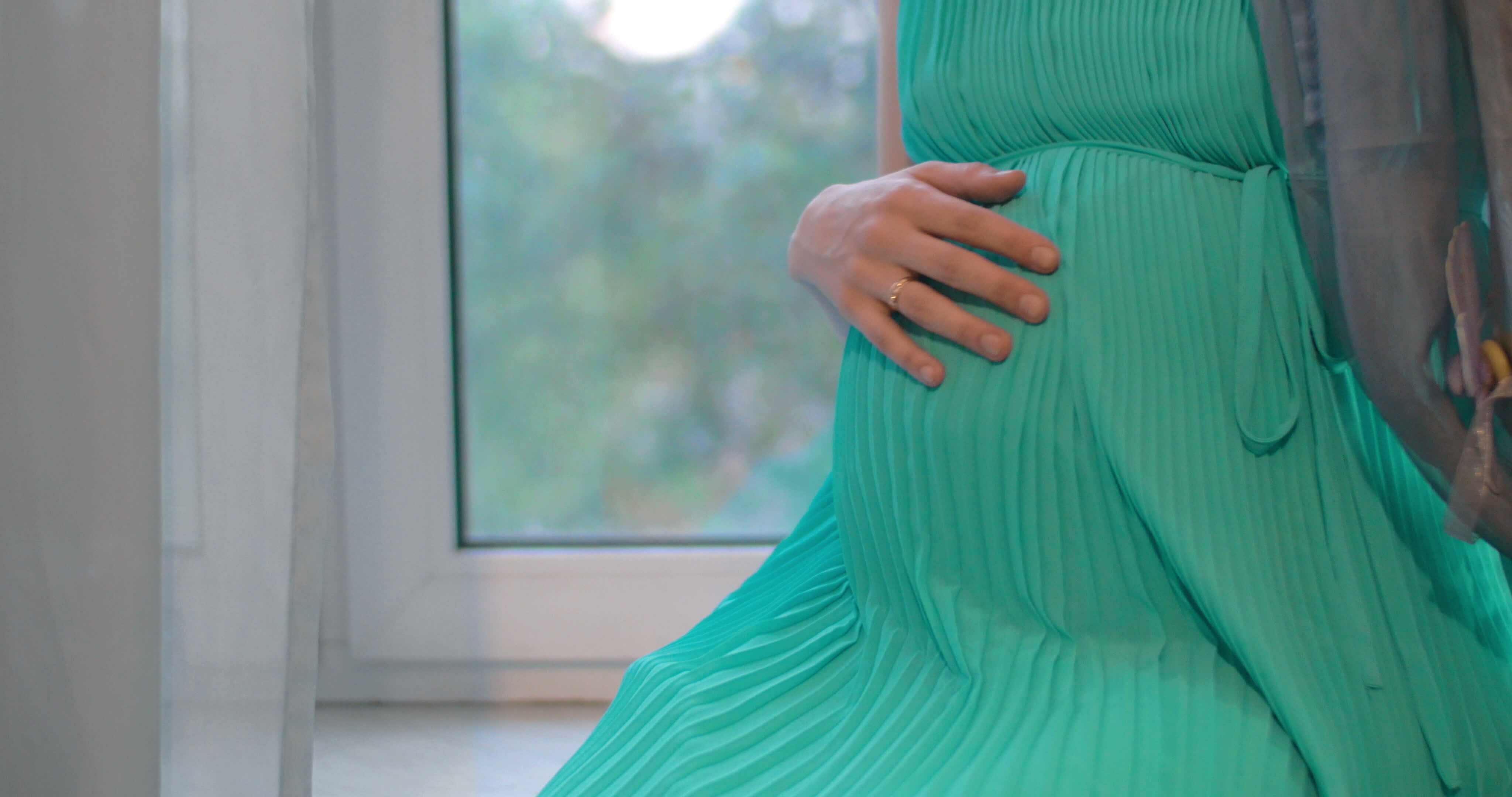 Pregnant woman embracing the belly 29172765 Stock Video at Vecteezy