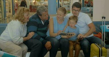 Big Family with Tablet in Waiting Room video