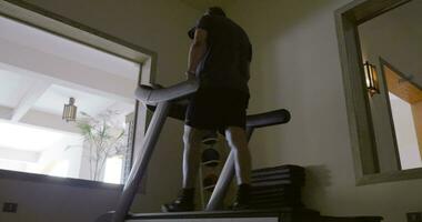 Man in the gym exercising on treadmill video