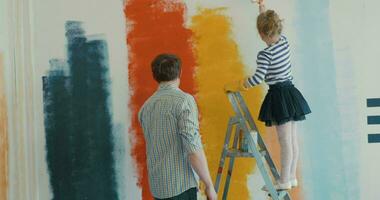 Father and Daughter Painting the Wall video