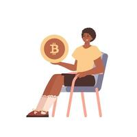 el chico es sentado en un silla y participación un bitcoin moneda en su manos. personaje en un moderno de moda estilo. vector