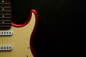 Electric guitar body isolated on black background. Entertainment and music concept. photo