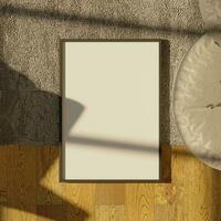 aesthetic frame mockup poster laying on the wooden floor with carpet lit by sunlight photo