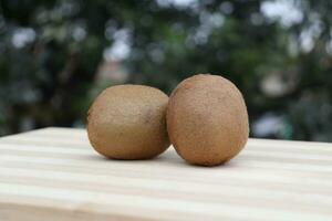 kiwi fruits on wooden background photo