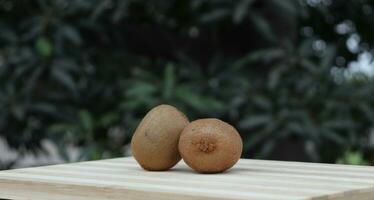 kiwi fruits on wooden background photo