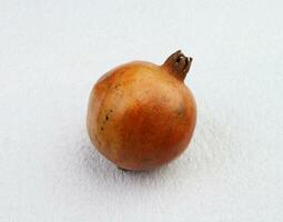 pomegranate in the white background photo