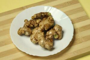 Ginger root in the plat photo