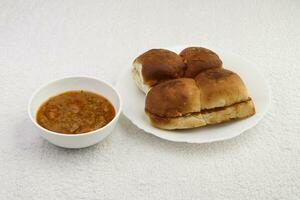 pav bhaji in white plate and white background photo