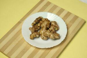 Ginger root in the plat photo