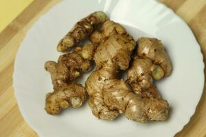 Ginger root in the plat photo