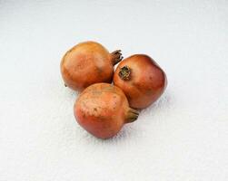 pomegranate in the white background photo