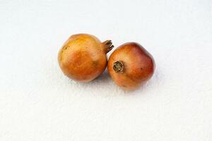 pomegranate in the white background photo
