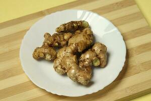 Ginger root in the plat photo