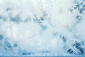 Elaborate frost patterns on winter windowpanes background with empty space for text photo