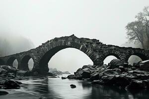 Eerie ancient stone bridge minimalist black and white background with empty space for text photo