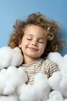 A child peacefully sleeping on a cloud isolated on a white background photo