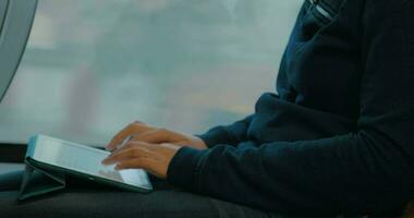 Chatting on tablet PC during train ride video