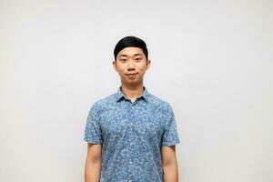 Positive asian man blue shirt smile portrait isolated photo