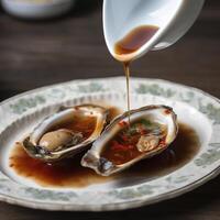 Shellfish sauce. Authentic oyster sauce served in an oyster shell. . photo