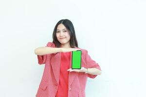 portrait of beautiful asian woman wearing red outfit holding mobile phone and smiling photo