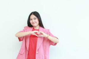 portrait of beautiful asian woman wearing red outfit with hand gesture of love photo