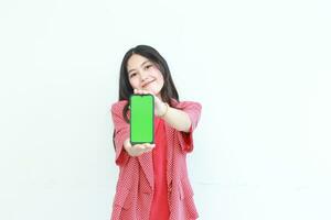 portrait of beautiful asian woman wearing red outfit holding mobile phone and smiling photo