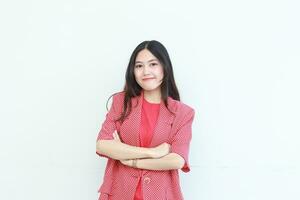 portrait of beautiful asian woman wearing red outfit with smiling gesture photo