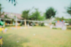 Defocused bokeh and blur background of garden trees in sunlight with vintage toned. photo