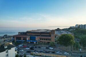 Beautiful Aerial Footage of British Tourist Attraction at Sea View of Bournemouth City of England Great Britain UK. High Angle Image Captured with Drone's Camera on September 9th, 2023 During Sunset photo