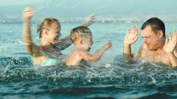 Happy family having fun in sea water video