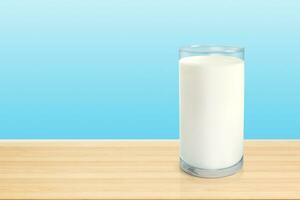 Milk in glass on wooden table isolated on blue background photo