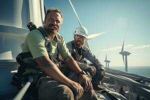 Construction workers standing in front of wind turbines photo