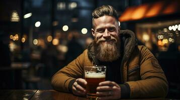 Brutal scandinavian man with glass of beer, bokeh blurred pub background photo