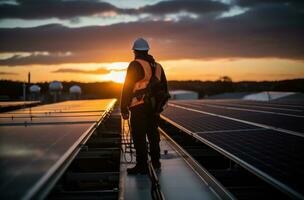 Technician installing solar panels on rooftop roof photo