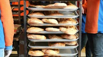 Bread baguettes in a basket in the baking shop. High quality photo video