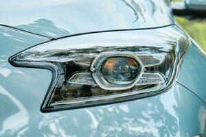 Modern car headlight with led lamp, close up photo