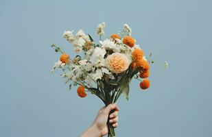 hand holding colorful arrangements flowers. Bright and sunny day with simple aesthetic romantic vibes. Perfect for wedding, greeting card, flower card, and more photo