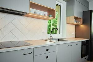 Modern kitchen interior with cabinets and empty countertop photo