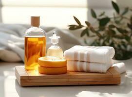 A spa with bar soap and a bottle of oil photo