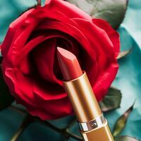 Red lipstick in a golden tube and blooming rose flower, beauty cosmetic and make-up product, generative ai photo