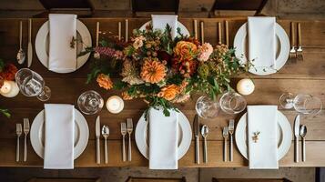 Autumn holiday tablescape, formal dinner table setting, table scape with elegant autumnal floral decor for wedding party and event decoration photo