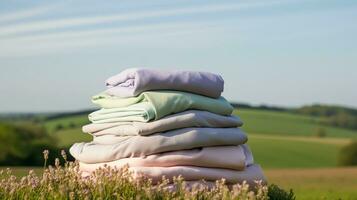 Laundry, housekeeping and homemaking, stack of clean and folded clothes in the countryside, generative ai photo