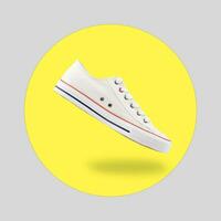 White female stylish sneakers on yellow background photo