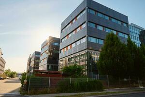 Modern office building with green trees photo