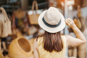 woman traveler visiting in Bangkok, Tourist with backpack and hat  sightseeing in Chatuchak Weekend Market, landmark and popular attractions  in Bangkok, Thailand. Travel in Southeast Asia concept 21601287 Stock Photo  at Vecteezy