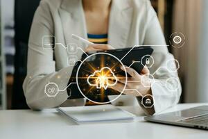 Woman use Laptop computer and tablet with cloud computing diagram show on hand. Cloud technology. Data storage. Networking and internet service concept. with virtual icon photo