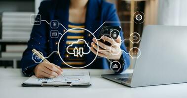 Woman use Laptop computer and tablet with cloud computing diagram show on hand. Cloud technology. Data storage. Networking and internet service concept. with virtual icon photo