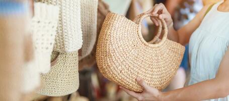 woman hand holding handcraft basket in wicker shop, Tourist visit at the old city in Chang Mai, Thailand. Asia Travel, Vacation and summer holiday concept photo