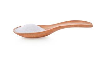 sugar in wooden spoon on white background photo