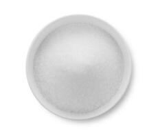 sugar in white bowl on white background photo